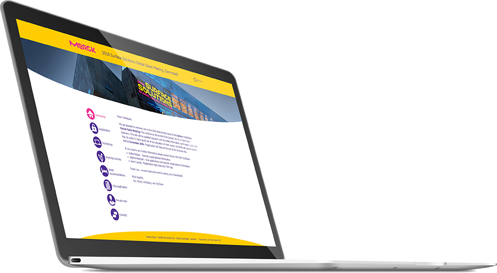 a laptop with Merck page screen on